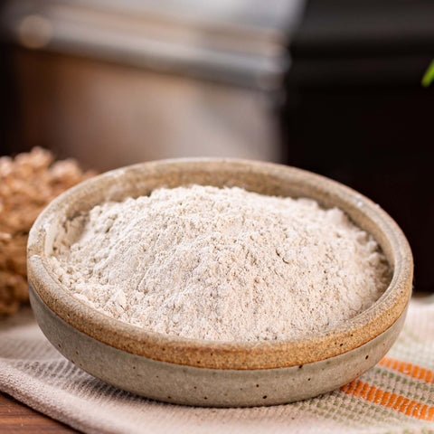 A bowl of Ground Up Organic Barley Malt Powder