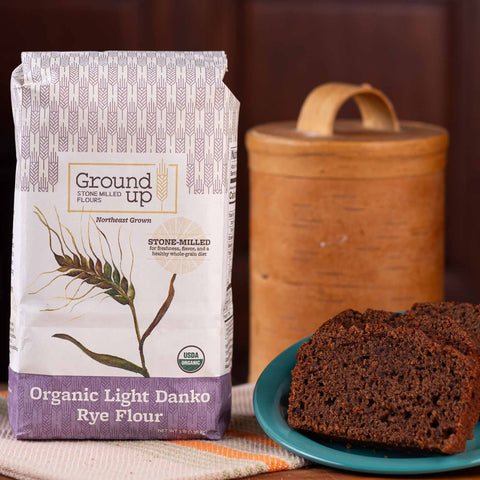 A 3pound bag of Ground Up Organic Light Danko Rye Flour, with rye and cocoa cake